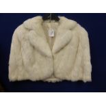 A Vintage White Rabbit Cape Jacket together with a Mink Style Fur Cape.