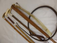 Two Antique Leather and Silver Collared Riding Whips and a silver collared Hunting Whip, with bone