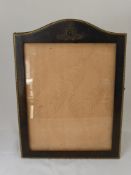 A Large Leather Picture Frame, with a Royal Artillery Badge to the top, 30 x 41 cms.