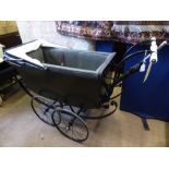 A circa 1910 " Select " pram together with a period umbrella, the pram having pottery handle bars,