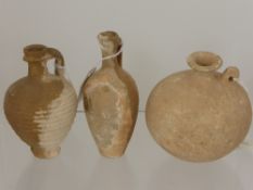 Three Roman 1st/2nd Century A.D Rough Finish Terracotta Vessels, all three approx 14 cms high.