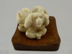 A Japanese Ivory Carved Netsuke depicting the three monkeys.  The carved figure having character