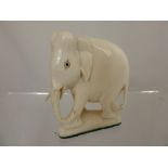 An Antique Ivory Figure of an Indian Elephant, approx 8.5 x 8 cms.