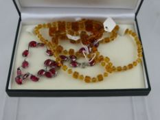 A Lady's Vintage Glass and White Metal Necklace, together with a yellow stone necklace. (2)