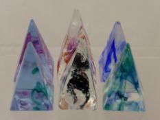 Six Caithness Pyramid Paperweights, including Green, Purple, Pink, Black, Sherbet and Cobalt.