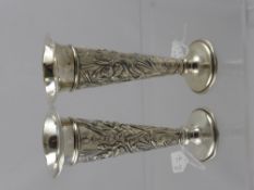 A Pair of Silver Posy Vases, embossed with flag iris and water reeds, London hallmark, pprox 16 cms,