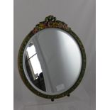 A circular vintage dressing table mirror having bevelled glass, the framed decorated with hand