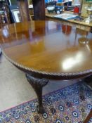 A  Edwardian Mahogany wind out Oval ended Dining Table. with pie crust edging, two extra leaves on