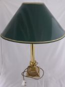 Three table lamps, one having a brass corinthian style column, another being in the form of a