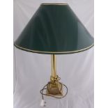 Three table lamps, one having a brass corinthian style column, another being in the form of a