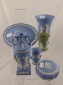 Thirteen pieces of Wedgwood Jasper Ware. Mostly blue and including 1 green vase , 3 blue trinket