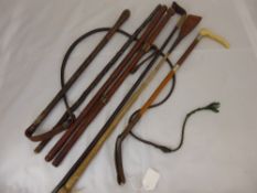 A Quantity of  Riding Whips, primarily leather braided and one hunting whip.