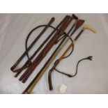 A Quantity of  Riding Whips, primarily leather braided and one hunting whip.