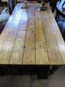 A vintage pine farmhouse table on turned legs, the top being planked, est. 184 x 93 x 76 cms.