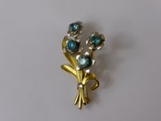 A Lady's 9ct Yellow and White Gold Flower Spray Brooch, the brooch set with four blue zircons (4.3