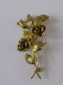 A Lady's 9ct Gold Flower Spray Brooch, the yellow gold brooch set with two garnets, approx wt 5.