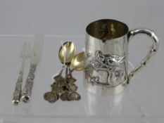 A Solid Silver Chinese Christening Mug, depicting a chasing dragon approx 160 gms,   together with a