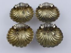 Four Shell Form Silver Salt Cellars, Birmingham hallmark 1907,a pair of silver sugar nips together