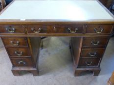 An Edwardian Mahogany Knee Hole Desk, having four drawers to either side, approx 102 x 57 x 75 cms