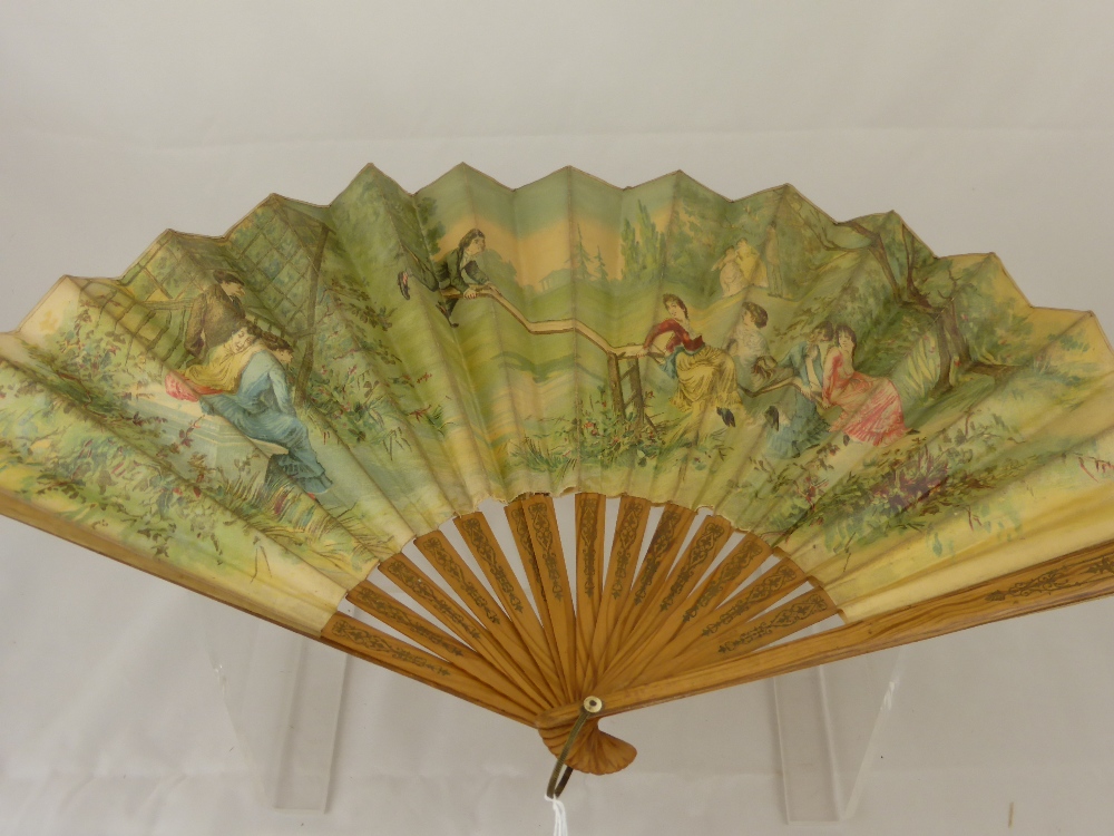 A Late 19th Century Lady's Fan, the fan hand painted with a scene of a family at play in a garden, - Image 2 of 2