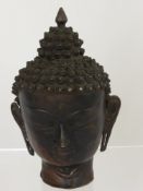 A 17th century Bronze Sino-Tibetan Head Bust depicting Buddha with an elaborate headdress, est