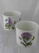 Two Portmeirion Botanical Garden planters, both with floral decoration, approx. 21 cms. diameter, 17