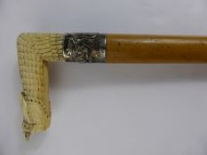 An Antique Silver Banded Chinese Walking Stick with ivory handle (WAF).