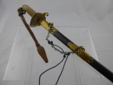 An Imperial Japanese Officer's Sword. The sword having a brass floral decorated guard with flip down