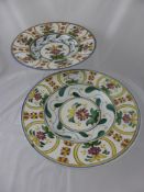 A pair of continental style chargers, having floral decoration, approx. 35 cms. diameter (2)