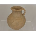 A Roman Earthenware Jug, Eastern Mediterranean with traces of incised decoration, Second/Third