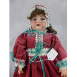 An Armand and Marseille Porcelain Headed Doll, nr 390-A 6.1/2 M, the doll having an open mouth and