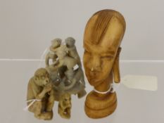 A Soapstone Study of Mischievous Monkeys,  together with a soap stone figure of a baboon and a (