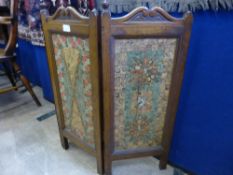 A vintage oak fire screen decorated with used postage stamps, Perfecto's labels etc. approx, 90