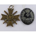 A German WWII Wound Badge together with Nazi Merit Cross (2)