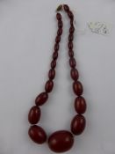 An Antique Red Amber Necklace, the necklace strung on a fine chain, approx length 45 cms, the