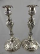 A Pair of circa 1850 Solid Silver Russian Candlesticks. The Rococo Style Candlesticks having