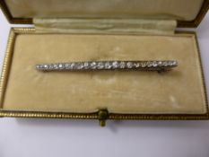 A Lady's Platinum and Graduated Diamond Bar Brooch, 24 dias approx 54 pts 3.8 gms total wt.