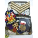A Box of Miscellaneous Military Badges, including cloth and metal.