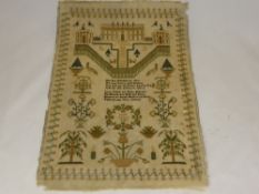 A Victorian Silk Embroidered Sampler, depicting a stately home with decorative floral border, signed