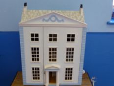 A Doll's House in the form of a Georgian three storey town house with accessories, furniture and