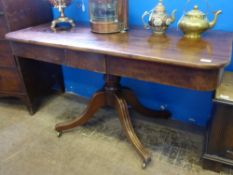 A Victorian Mahogany Hall Table on a turned bulbous column with four splayed feet on castors,