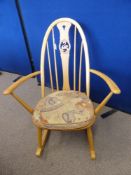 A Light Beech Ercol Swan Back Rocking Chair.