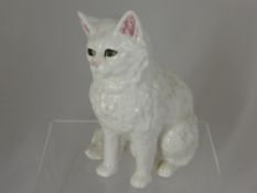 A Portugese white ceramic figure of a cat, approx. 29 cms. in height.