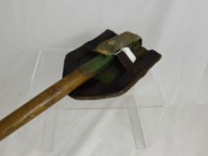 A German WWII Folding Trench Shovel with cover.