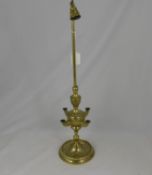 A Brass Middle Eastern Lucerne Lamp, the four branch lamp of decorative foliate design with bell