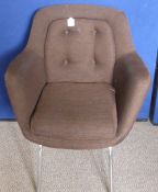 A Retro Arm Chair with Stainless Legs and brown woven upholstery.