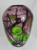 A Millefiori Murano Glass Vase. The vase depicts floral decoration and bold green highlights, approx