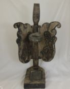 A Wooden Dayak Tribal Offering Light Stand, depicted standing with open wings, approx 70 cms high.