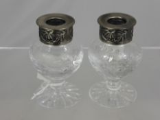 A Pair of Royal Brierley Crystal Candlesticks, topped with pewter drip pans decorated with floral