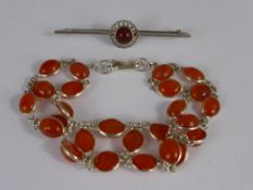 A Silver and Cornelian Bracelet and Pin Brooch.